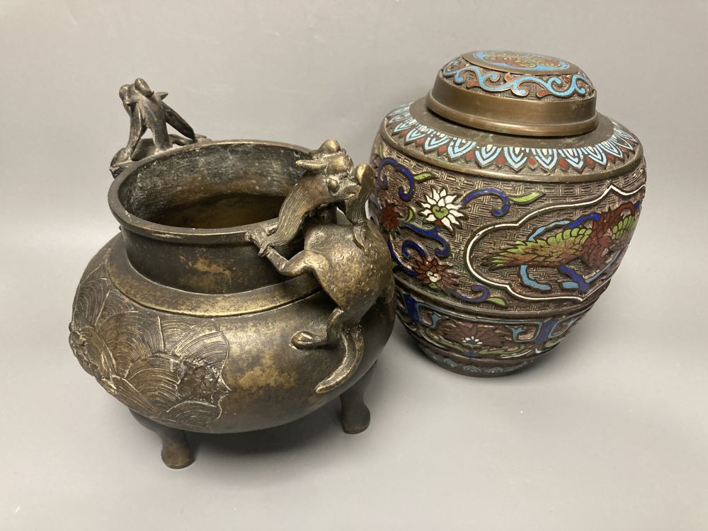 A 19th century Chinese bronze two handled tripod censer, overall height 19cm and a champleve lidded jar